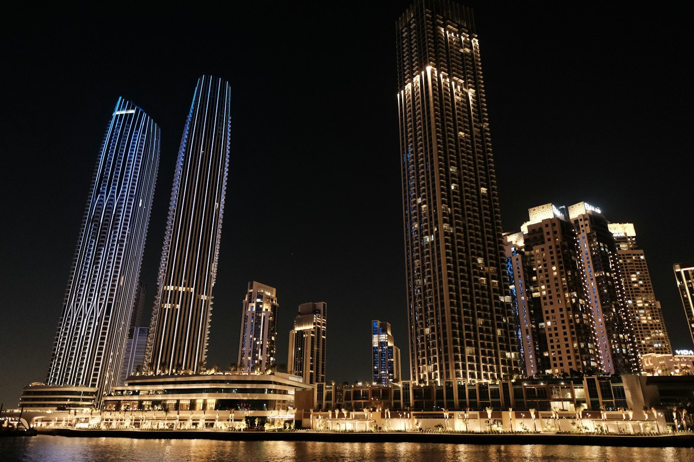 Illuminated residential towers on the Dubai Creek Harbour waterfront